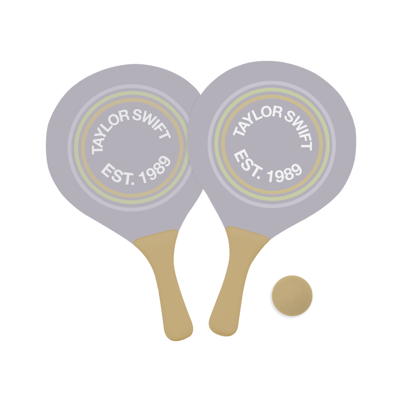 Set of two lavender paddles featuring "Taylor Swift, Est. 1989" printed in a circle on front with one gold ball.