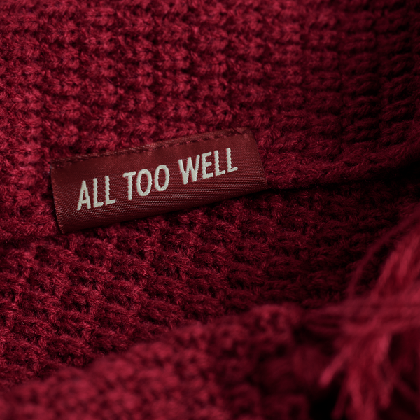 The All Too Well Knit Scarf Front Tag